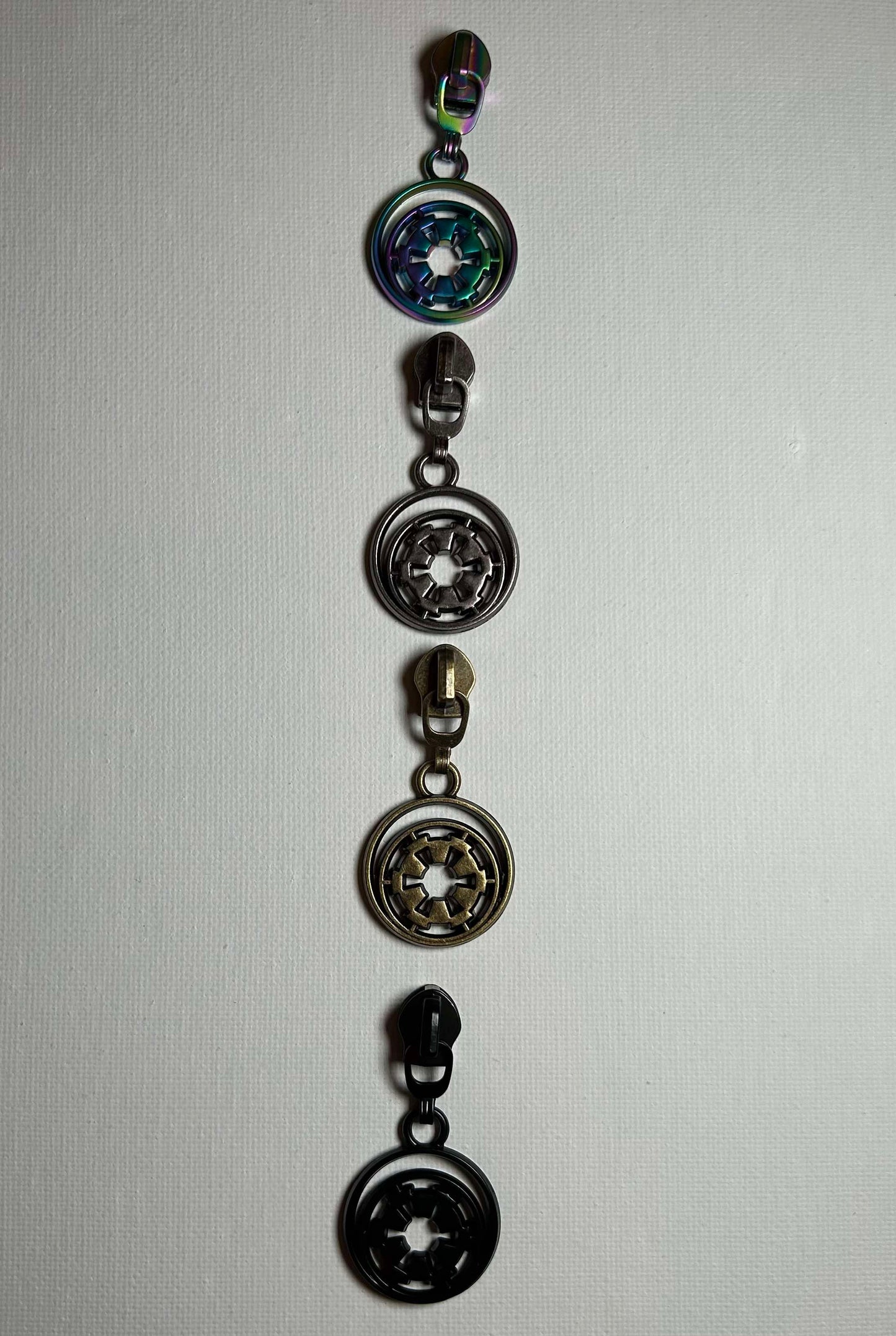 *RETAIL* Floral E Symbol Zipper Pulls